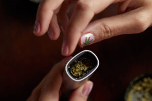 High-quality hashish concentrate on dab tool showing golden-brown texture and consistency